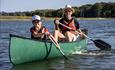 Adult and child canoeing