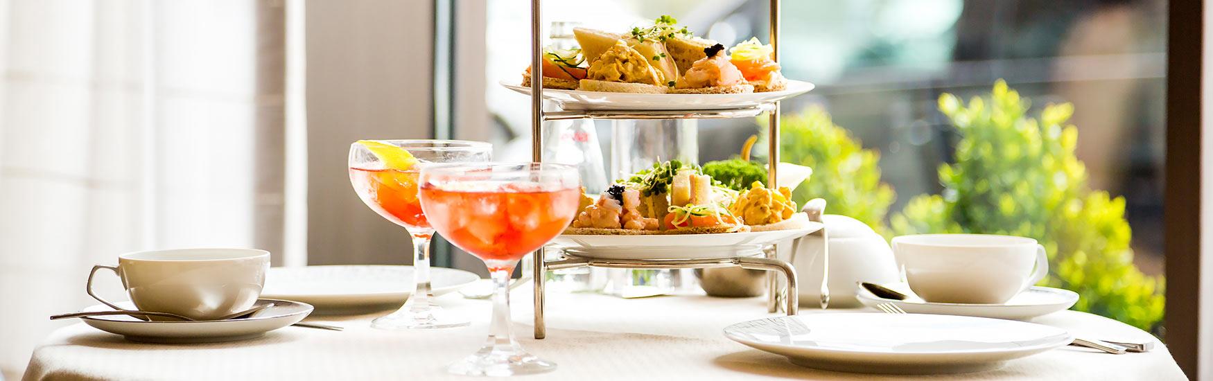A delicious looking afternoon tea with cocktails