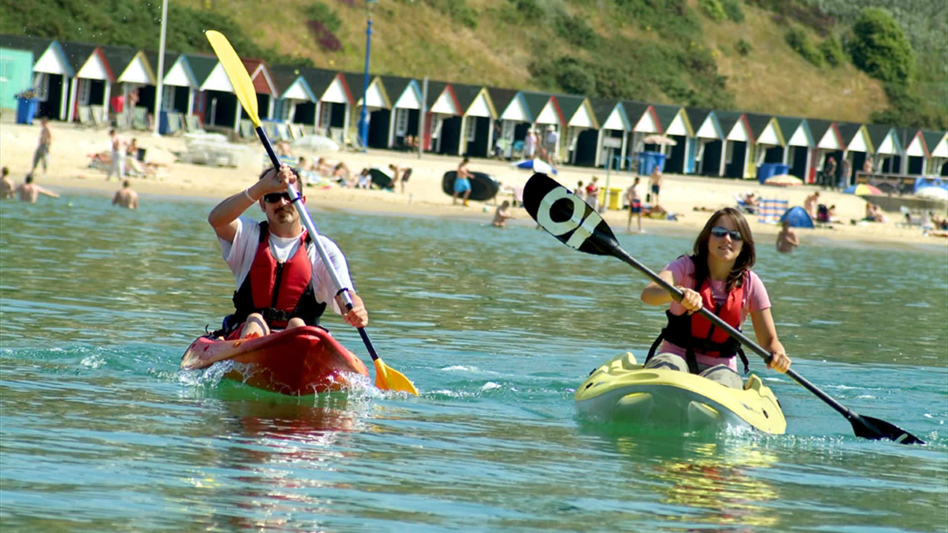 Two people kayaking in the sea at Bournemouth