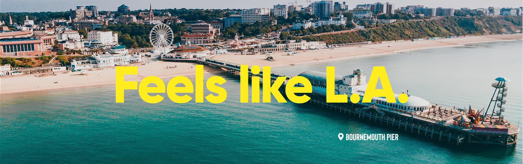 Aerial shot of Bournemouth Pier with text that reads "Feels like LA" overlaid