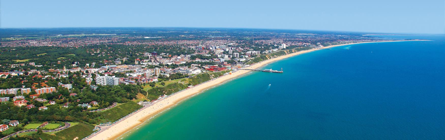 Sweeping shot of Bournemouth from the Air Turquoise Sea Bay