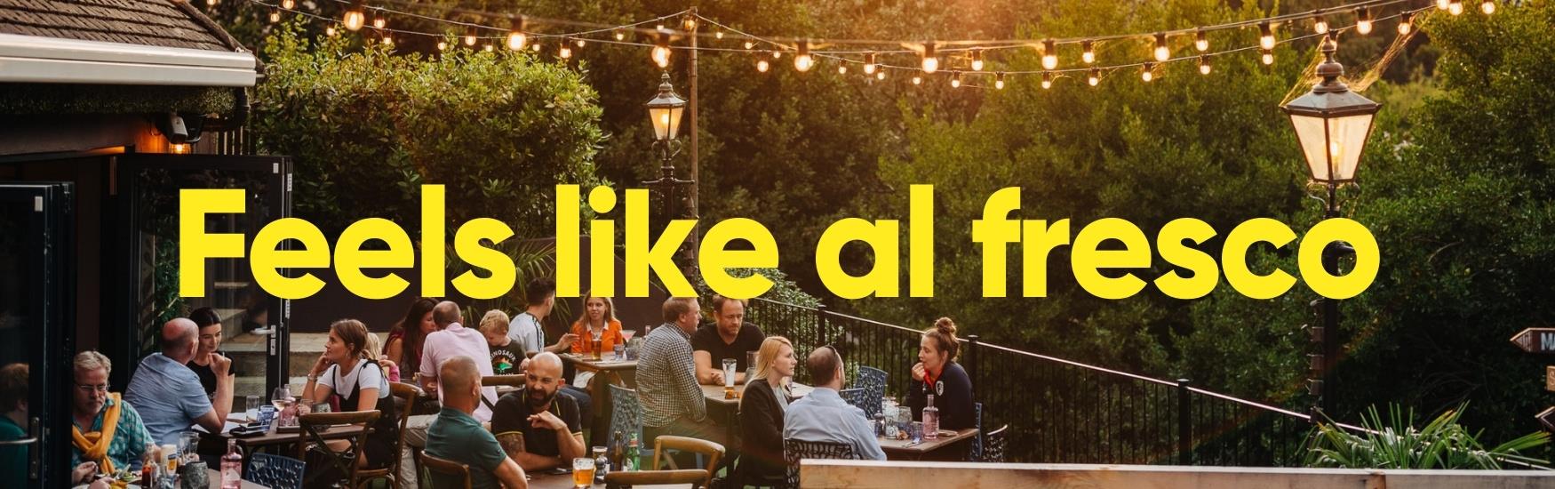 customers enjoying the outside area at Urban Garden in Bournemouth with text that reads "feels like al fresco"