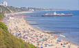 Visitors enjoying their time on Bournemouth beach whilst soaking in the summer sun