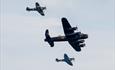 Three world war 2 planes flying in formation over Bournemouth Beach