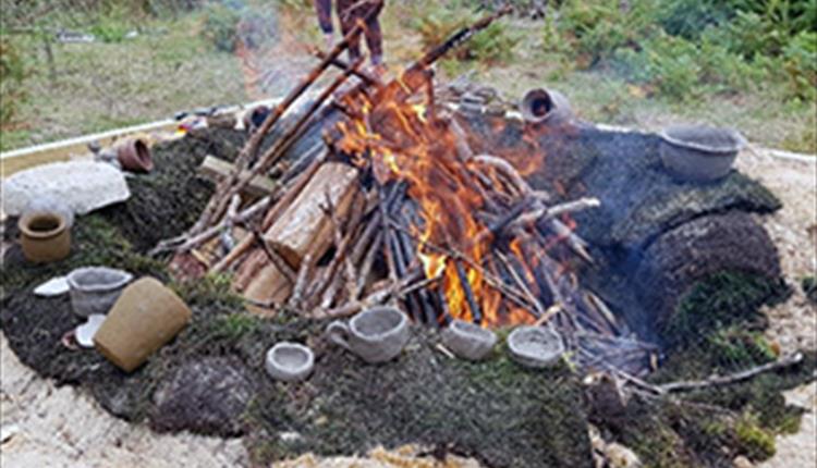 a small bonfire firing pottery