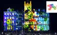 Bournemouth's town hall lit up by a projector showing amazing images and videos at night
