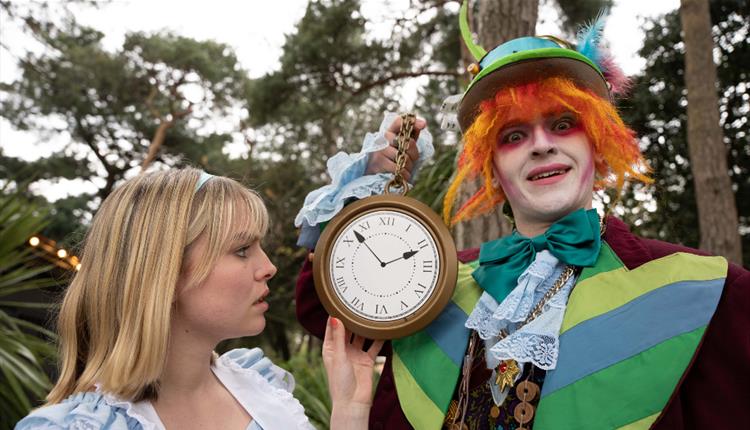 Alice and Mad Hatter with a clock