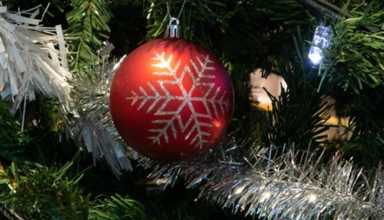 bauble on a christmas tree with silver tinsel in the background
