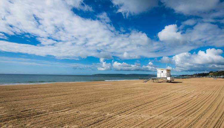 Durley Chine beach featuring RNLI Lifeguard tower