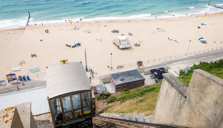Fisherman's Walk Cliff lift with seafront view featuring sandy beach and blue sea