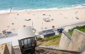 Fisherman's Walk Cliff lift with seafront view featuring sandy beach and blue sea