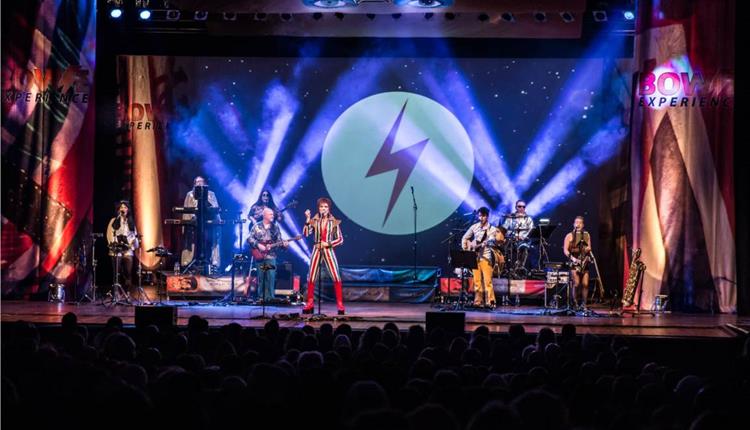 photo of the stage during the Bowie experience with David Bowie's famous lightening symbol.