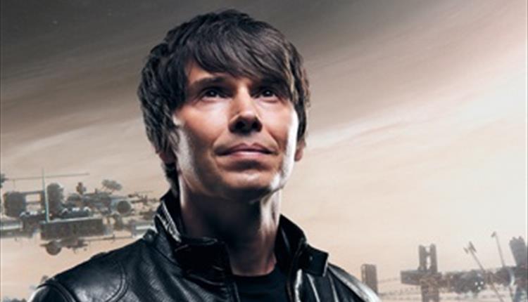 Professor Brian Cox in a leather jacket looking slightly upwards