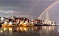 Colourful rainbow over arching Poole Quay and the Yellow Ferries