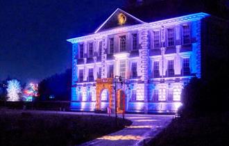Kingston Lacy house lit up in christmas lights.
