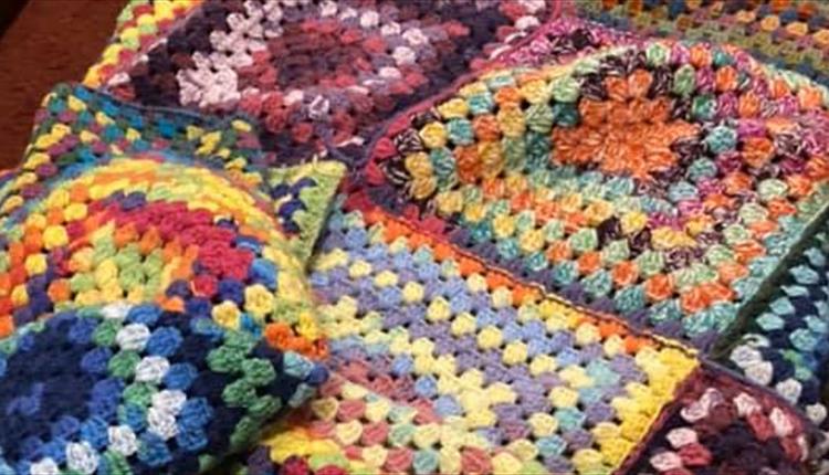 A colourful crochet blanket.