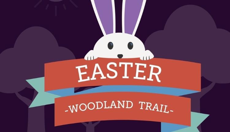 Easter Woodland Trail poster with a cartoon bunn peering over the top