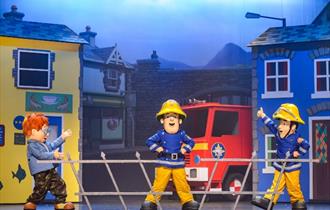 Image of three fireman Sam characters mid show.