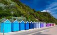 Colourful beach huts lined up Bournemouth Seafront
