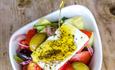 greek salad with olive oil and herbs The Real Greek