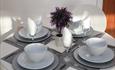 Table set up for breakfast with grey and white colour tones