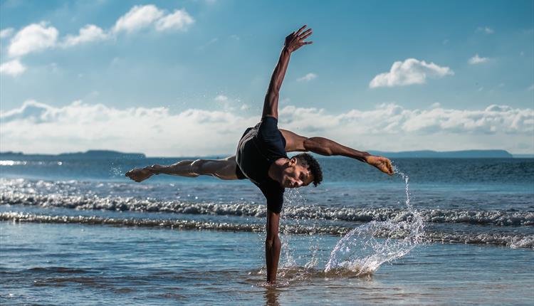 dancer performs in the sea