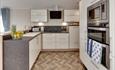 Contemporary kitchen with stylish parquet flooring Meadowbank Holidays