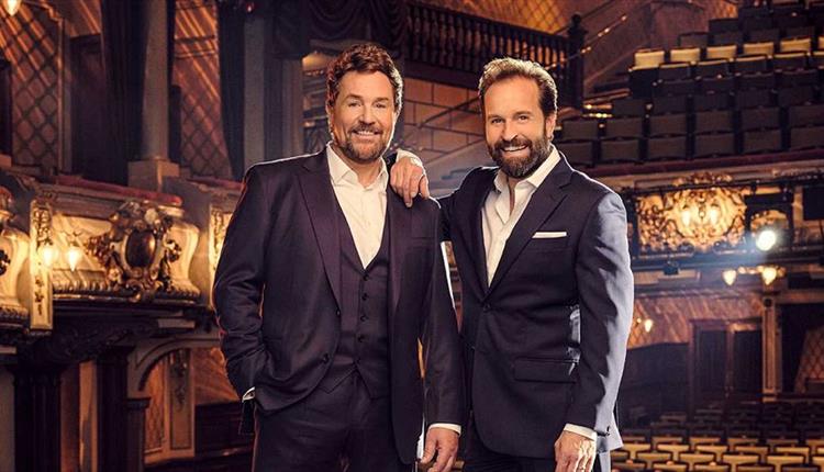Michael Ball and Alfie Boe standing together in the theatre