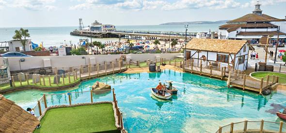 Overhead shot of the stunning smugglers crazy golf with Bournemouth beach and pier in the background