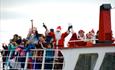 Santa and friends on his Poole themed sleigh (a boat)