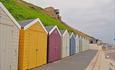 Row of colourful beach huts at southbourne