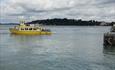 Yellow Brownsea Island Ferry leaving the dock