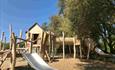 Wooden play structure with slide