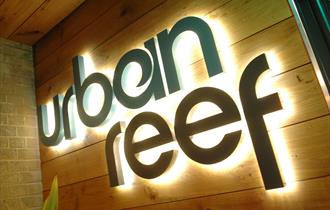 Urban Ree's logo on the front of the restaurant in Bournemouth