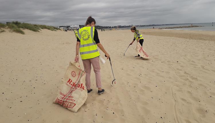 Two beach cleaners at sandbanks