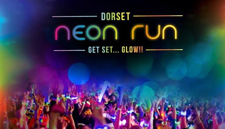 Dorset neon run logo over image of runners with their hands in the air