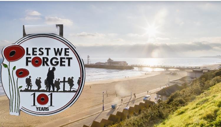Bournemouth pier in the sunlight with Lest We Forget sign