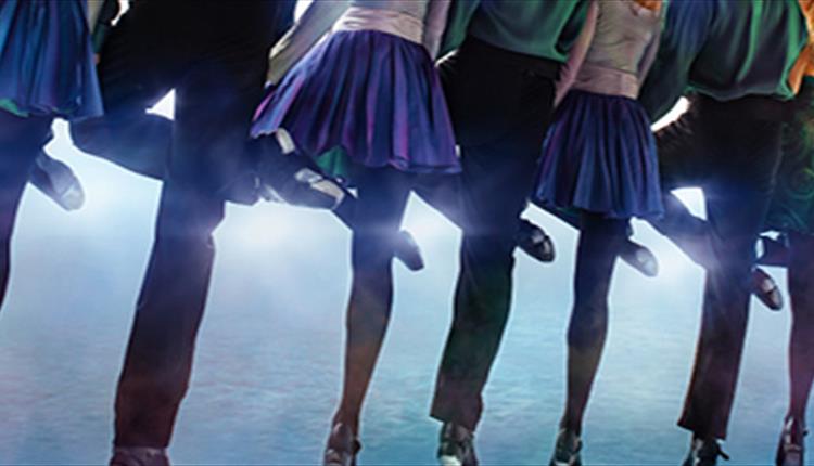 A row of dancers' legs.