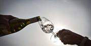 Albourne Estate - pouring a glass of wine