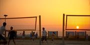 Yellowave Beach Sports Venue - netball game during sunset