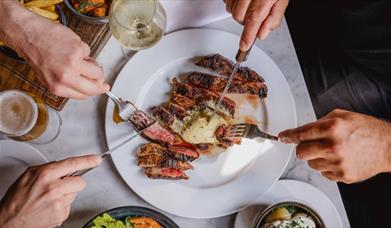A sumptuous looking plate of steak.