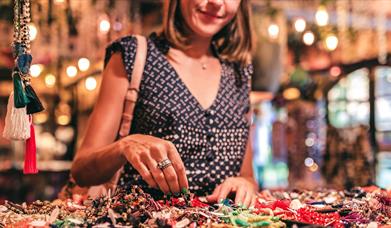 Woman browsing handmade crafts