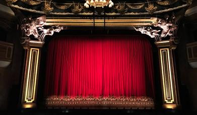 Red curtain at a performance theatre