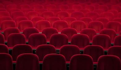 Empty red seats in a theatre