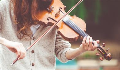 Person playing a violin