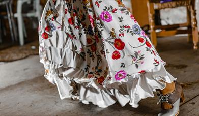 White dress with ruffles and bright flowers
