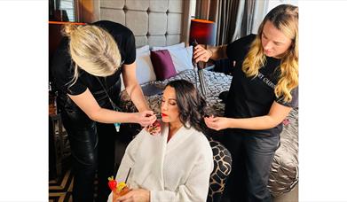 Lady being made up before an event.