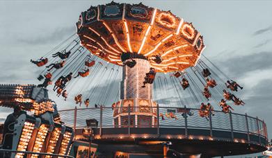 Fun fair ride with bright lights