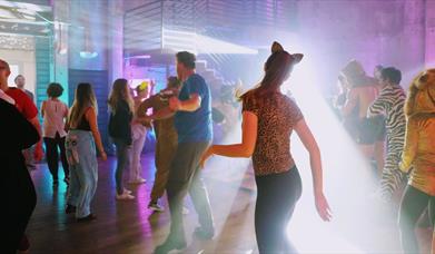 Costume dance party with bright lights