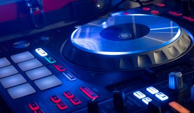 Blue lit turntable with white and red lights